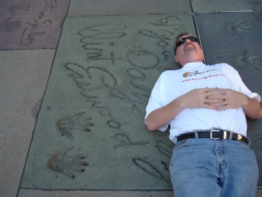 Hollywood tourist trek: Here I am having a quick snooze beside Clint EASTWOOD mark