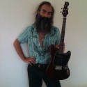 Warren Ellis with his signature Eastwood Tenor Guitar (Cherry Finish)