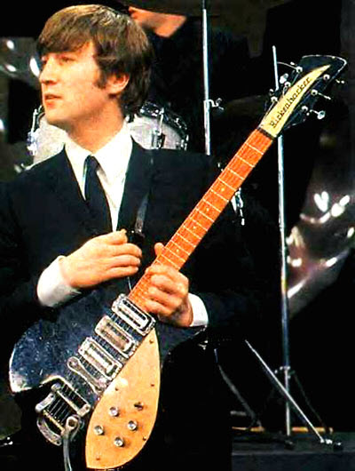 John Lennon with his 1958 Rickenbacker 325 Capri guitar (The Beatles)