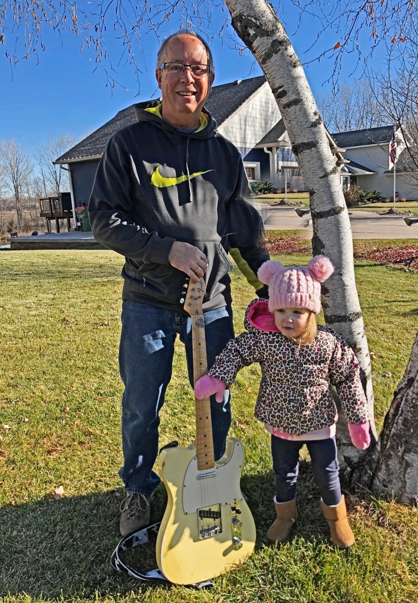 granddad, granddaughter and Fender telecaster