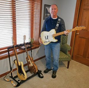 guitarist with guitars