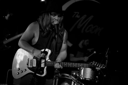 EPIC RUINS Sam Anderson with his white Eastwood Stormbird Guitar